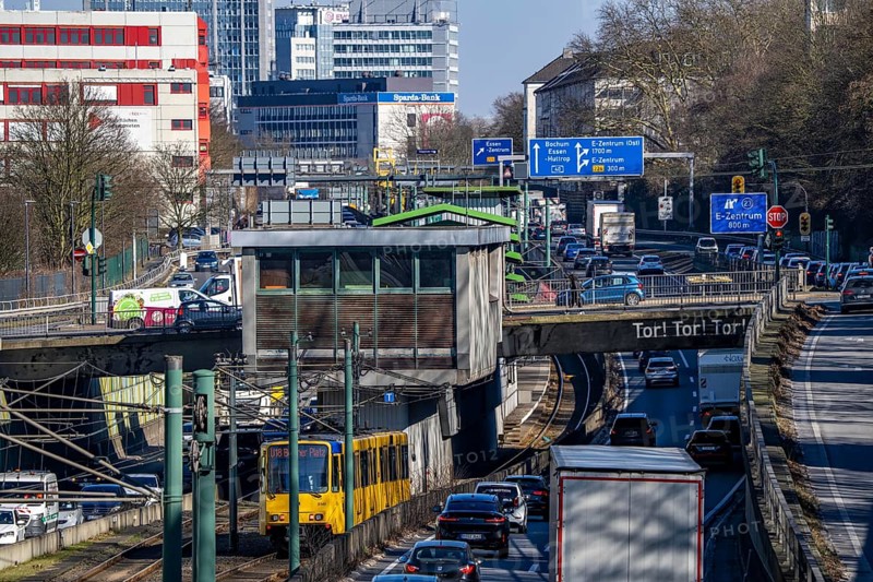 Motorway A40, Ruhr expressway, heavy traffic jam, rush hour, city passage in Essen, skyline of the city centre, underground line between the lanes, Hobeisenbrücke stop, North Rhine-Westphalia, Germany, Europe