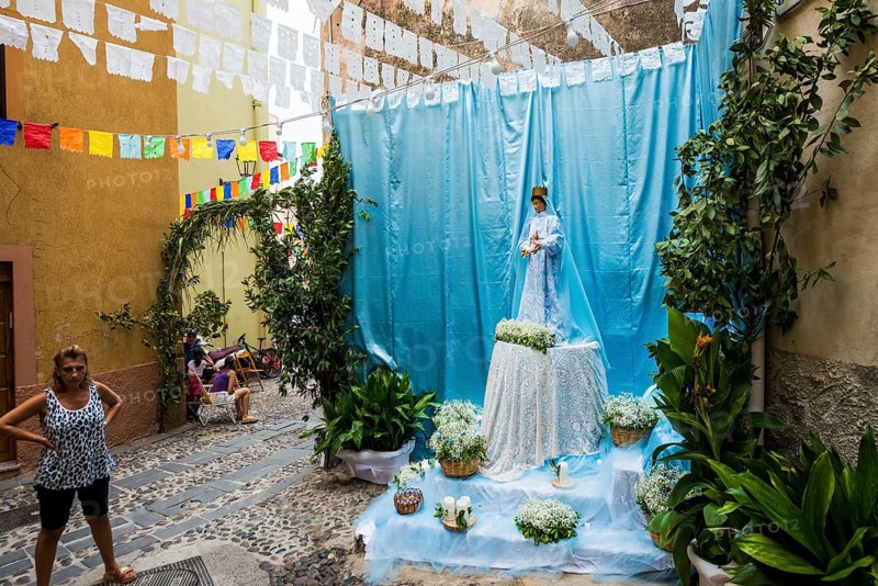Decorated alley and celebrating people, feast of the Madonna of Regnos Altos, Bosa, district of Oristano, Sardinia, Italy, Europe