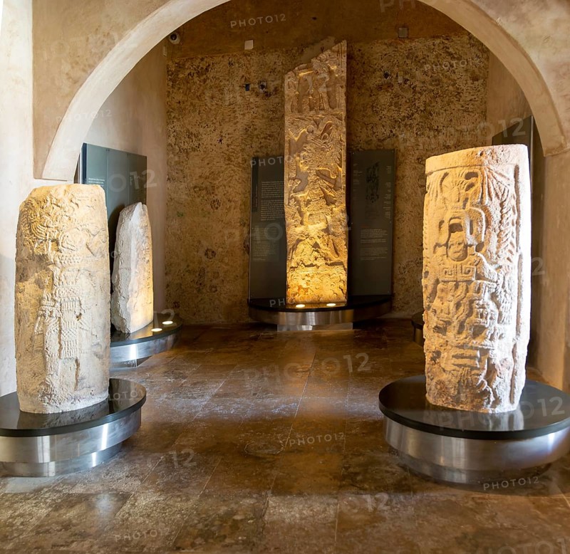Carved stonework stelae display inside museum of Mayan Archaeology, Campeche city, Mexico, Central America