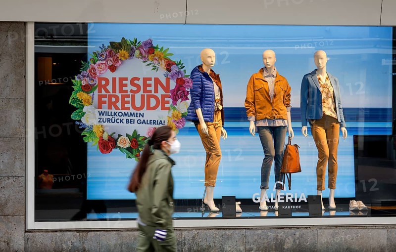 Düren, North Rhine-Westphalia, Germany - Düren city centre in times of the corona crisis during the second lockdown, most shops are closed, few passers-by in the pedestrian zone, Galeria Kaufhof Karstadt advertises Click & Meet in the shop window, register online and arrange a shopping appointment