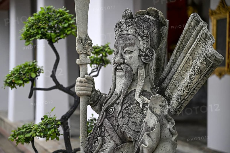 Stone statue of a Chinese warrior, guardian, Wat Pho, Temple of the Reclining Buddha, Bangkok, Thailand, Asia