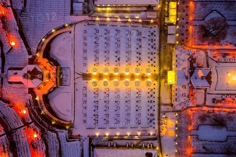 Aerial view of Wackerbarth Castle with castle park, belvedere and vineyards with snow and Christmas lights, Radebeul, Saxony, Germany, Europe