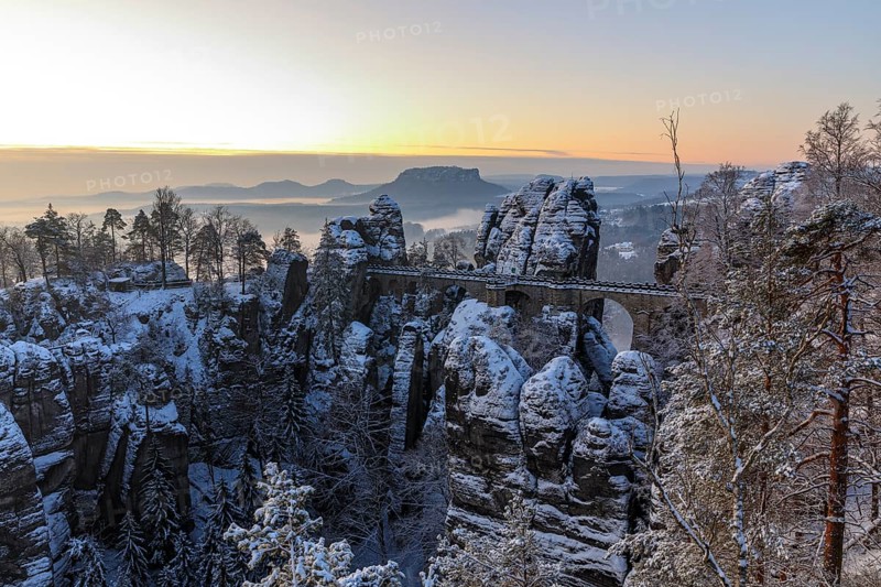 Snow-covered Bastei Bridge in the morning, in the background the Lilienstein, Saxon Switzerland, Saxony, Germany, Europe