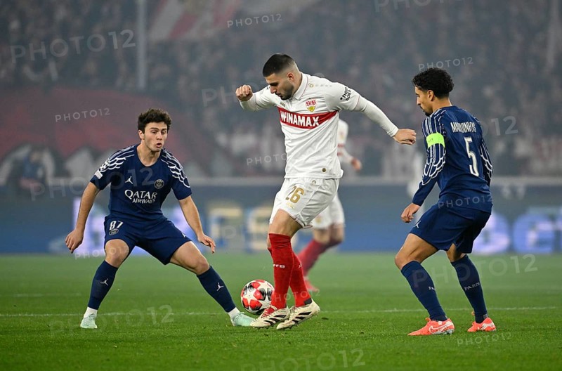 Duel, action Deniz Undav VfB Stuttgart (26) (centre) against Marquinhos FC Paris Saint-Germain PSG (05) Joao Neves FC Paris Saint-Germain PSG (87) (left) Champions League, MHPArena, MHP Arena Stuttgart, Baden-Württemberg, Germany, Europe