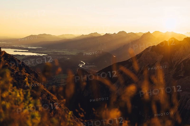 View from the Aggenstein and the foothills of the Alps in Ostallgäu and the Ammergebirge at sunrise, Bavaria, Germany, Europe