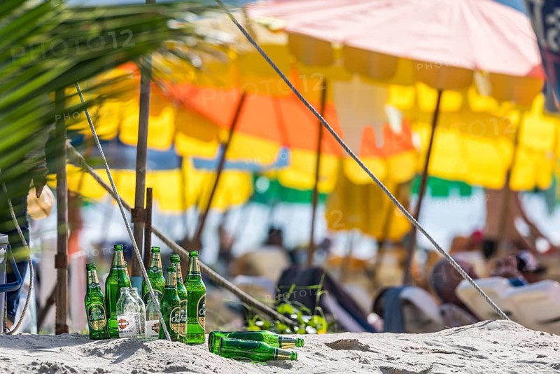 Overtourism in Thailand. Mass tourism on the sandy beach of Patong, the deckchairs are packed closely together. The beach stretches for around three kilometres along the Indian Ocean. Patong, Kathu, Phuket Island, Thailand, Asia