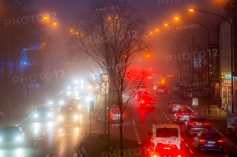 Dense fog, with visibility sometimes less than 100 metres, city centre traffic at rush hour on Alfredstraße, B224, in Essen, North Rhine-Westphalia, Germany, Europe