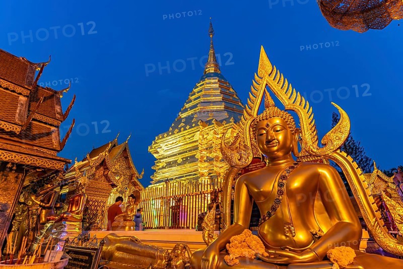 Buddha statue and Golden Chedi of the Buddhist temple complex Wat Phra That Doi Suthep, landmark of Chiang Mai at dusk, Thailand, Asia