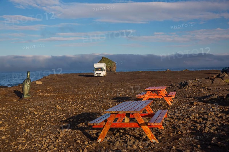 Motorhome parking on the shoreline, south of Sandvik with crashing waves. Rough nature