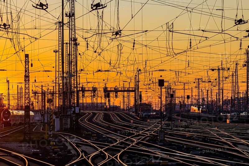 Track apron with trains, rails, points, pylons and signalling systems. Infrastructure at the main station. Sunset. Frankfurt am Main, Hesse, Germany, Europe