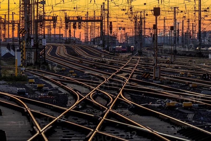 Track apron with trains, rails, points, pylons and signalling systems. Infrastructure at the main station. Sunset. Frankfurt am Main, Hesse, Germany, Europe