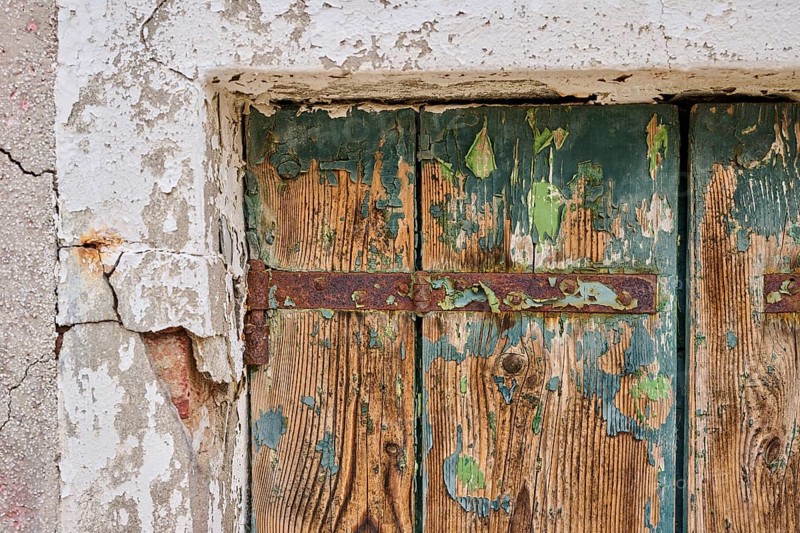 Detail of weathered wood from an old window shutter, Burano, Venice Italy