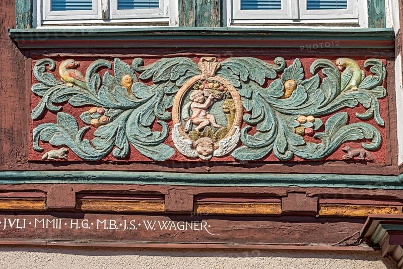 Colourfully painted carvings, medallion with putti, paradise, floral ornaments, half-timbered house of Georg Karl Happel, Gasthaus Zum Goldenen Löwen, market square, historic old town, Butzbach, Wetterau, Hesse, Germany, Europe