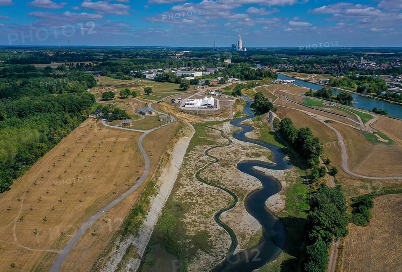 Recklinghausen, Castrop-Rauxel, North Rhine-Westphalia, Germany, EMSCHERLAND construction project, a 37-hectare water and nature discovery park at the water crossroads of the Rhine-Herne Canal (right) and the renaturalised Emscher (centre) on the city limits of Recklinghausen and Castrop-Rauxel. The ecological focus at the confluence of Suderwicher Bach (left) and Emscher (centre) will also be a future garden for the International Garden Exhibition 2027. Before the renaturation, the Emscher river system was an open, above-ground wastewater canal, combined sewer with surface water and wastewater. The Uniper power plant Datteln 4 in the background, Europe