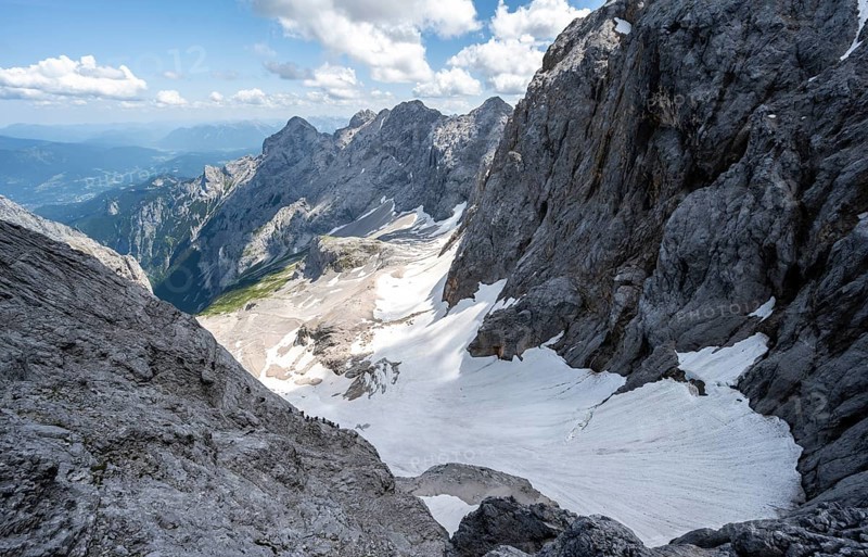 View of mountain basin with snow field of the Höllentalferner and Höllental, Zugspitze via ferrata, ascent to the Zugspitze, Wetterstein range, Bavaria, Germany, Europe