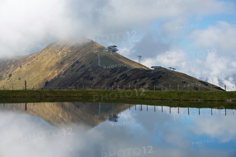 Artificially created lake, snow pond, feeds the snow cannons that completely cover the slopes of the Fellhorn and Kanzelwand cable cars with snow, behind it the Fellhorn, 2038m, Allgaeu, Allgaeu Alps, Bavaria, Germany, Europe