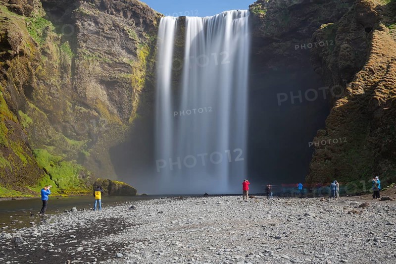 Skógafoss is a waterfall situated on the Skógá River in the south of Iceland. Height 60 m, width 25 m. People in front of the fall