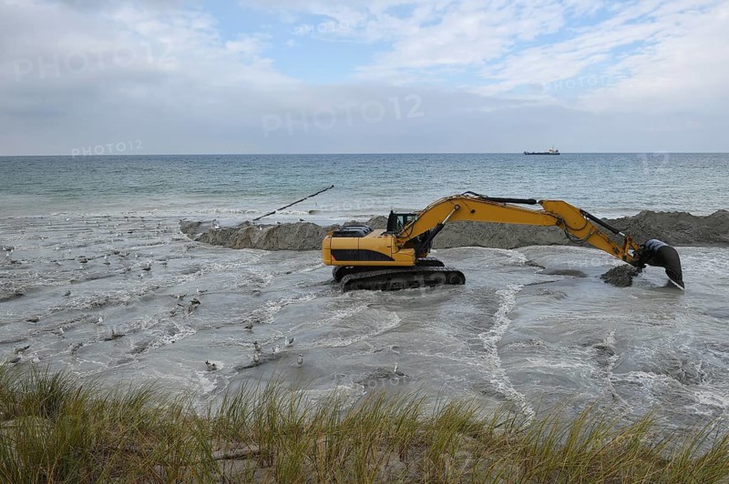 Excavators working to reclaim land on the beach of the Darß peninsula, Mecklenburg-Western Pomerania, Germany, Europe