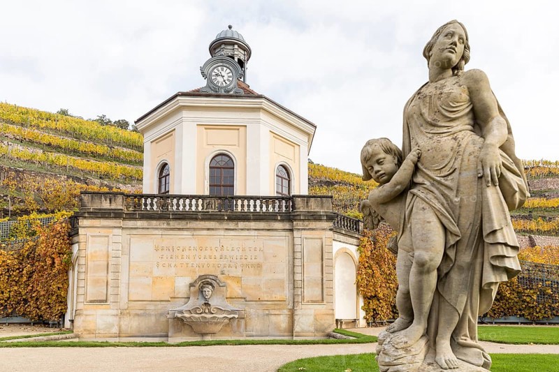 Belvedere of Wackerbarth Castle and sandstone figure with autumn-coloured vineyards, Radebeul, Saxony, Germany, Europe