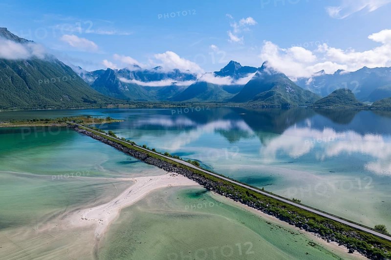 Fjord and mountains of the island Austvågøya, road on dam, Grunnførfjorden, Lofoten, Norway, Europe