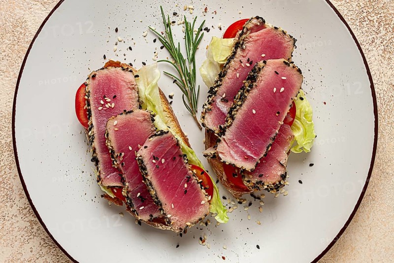 Sandwiches with fried tuna fillet, sesame, breakfast, top view, homemade