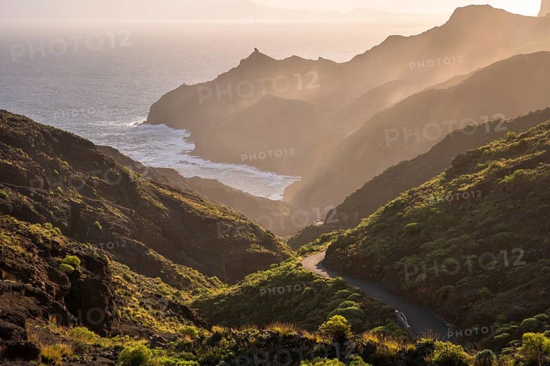 View of Punta San Lorenzo, Punta Sabina and the road to Playa de La Caleta. In the morning, good weather, mist rising in the valleys. La Gomera, Canary Islands, Spain, Europe