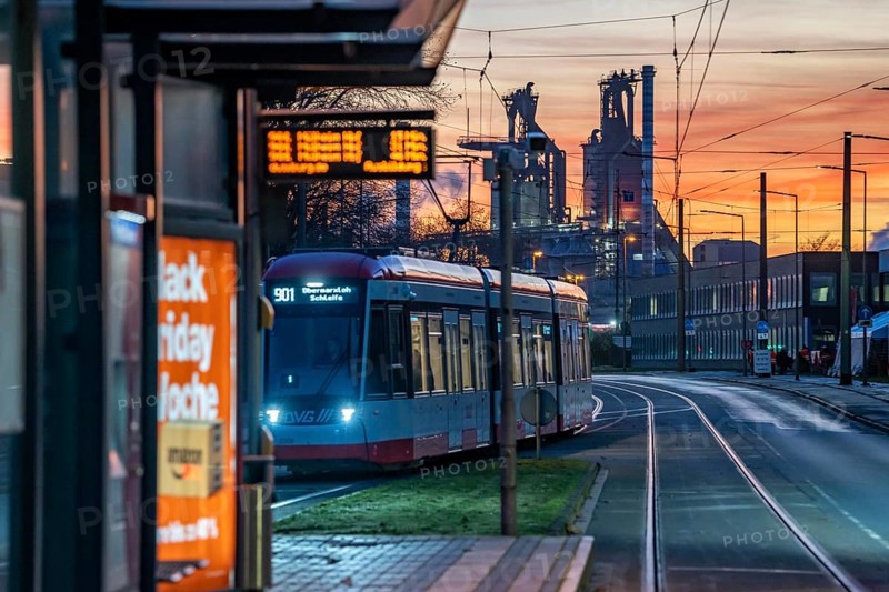 Duisburg-Bruckhausen steel site, ThyssenKrupp Steel, blast furnaces 8 and 9, on Kaiser-Wilhelm-Straße, sunset, tram, North Rhine-Westphalia, Germany, Europe