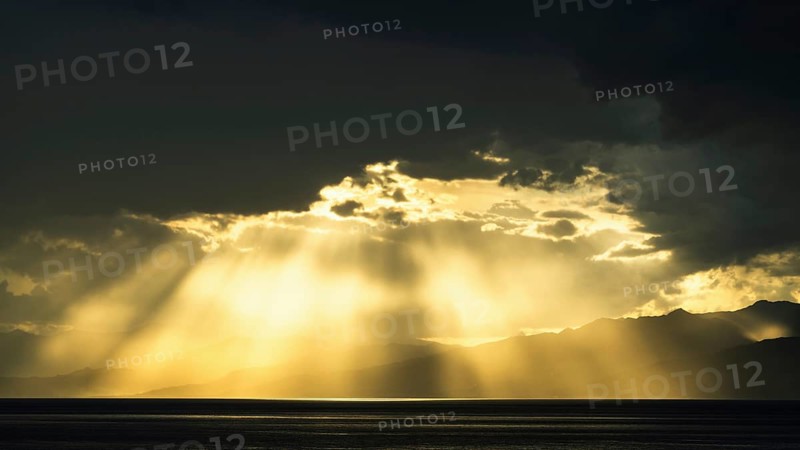 Sun rays in the clouds over Sicily, Tyrrhenian Sea, Italy, Europe