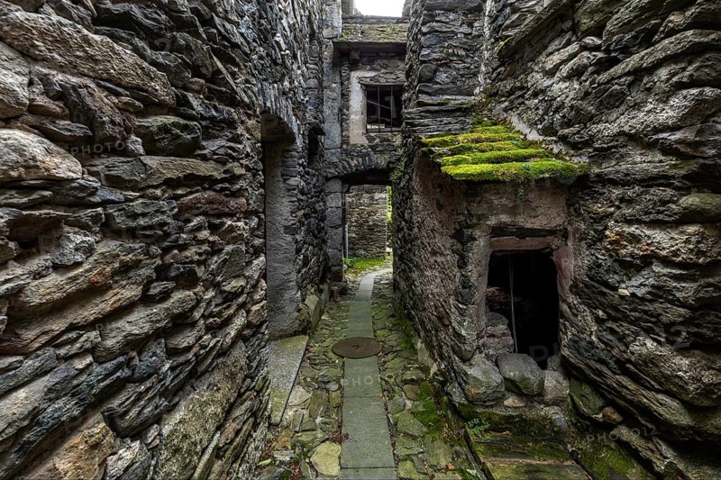 Typical Ticino stone houses in a narrow alley in the mountain village of Bordei, Centovalli, Canton Ticino, Switzerland, Europe