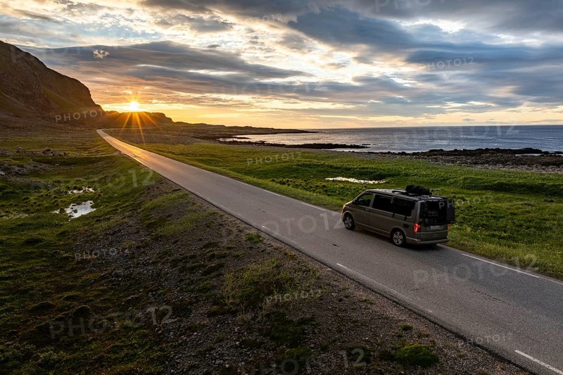 Camper van travelling along the road to Berlevåg, VW California, Barents Sea, Varanger, Finnmark, Norway, Europe