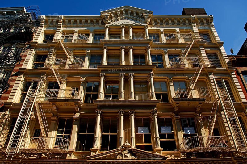 Neoclassical house facade with fire escapes, Downtown, New York City, USA, North America
