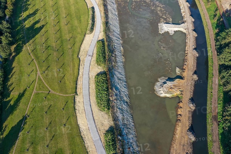 Recklinghausen, Castrop-Rauxel, North Rhine-Westphalia, Germany - EMSCHERLAND construction project, a 37-hectare water and nature discovery park at the water crossroads of the Rhine-Herne Canal and the renaturalised Emscher (right) . The ecological focal point at the confluence of Suderwicher Bach and Emscher will also be a future garden for the International Garden Exhibition 2027. Before the renaturalisation, the Emscher river system was an open, above-ground wastewater channel, combined sewer with surface water and wastewater