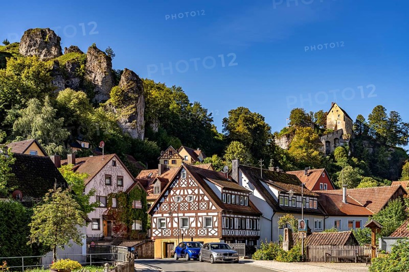 Half-timbered houses and the castle in Pottenstein in Franconian Switzerland, Bavaria, Germany, Europe
