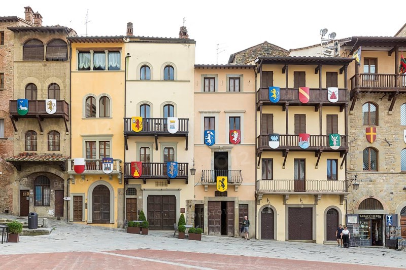 Piazza Grande with houses from different eras with wooden balconies and coats of arms, Arezzo, Tuscany, Italy, Europe