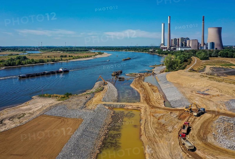 Dinslaken, Voerde, North Rhine-Westphalia, Germany, Emscher estuary into the Rhine. Construction site of the new Emscher estuary in front of the decommissioned STEAG coal-fired power station in Voerde. The mouth of the Emscher into the Rhine is being moved almost 500 metres north from Dinslaken to Voerde. Fish will then be able to swim barrier-free up the new Emscher from the Rhine through a newly created floodplain area. Following the construction of a parallel sewer, the Emscher has been completely free of sewage since January 2022. The river was previously an open, above-ground combined sewer with rainwater and wastewater, Europe