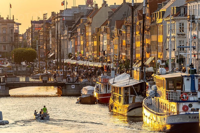 Colourful houses, restaurants and historic ships on the Nyhavn canal and harbour, Copenhagen, Denmark, Europe