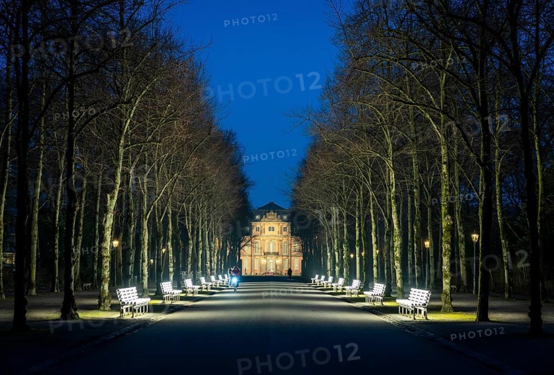 The light benches by artist Stefan Sous in the Hofgarten, entitled UV-A UV-B, 14 completely refurbished exhibits from the 2002 light-grey art exhibition, which now stand and light up as a permanent work of art on Jägerhofallee, LED technology, in the background Jägerhof Palace, home of the Goethe Museum, Düsseldorf, North Rhine-Westphalia, Germany, Europe