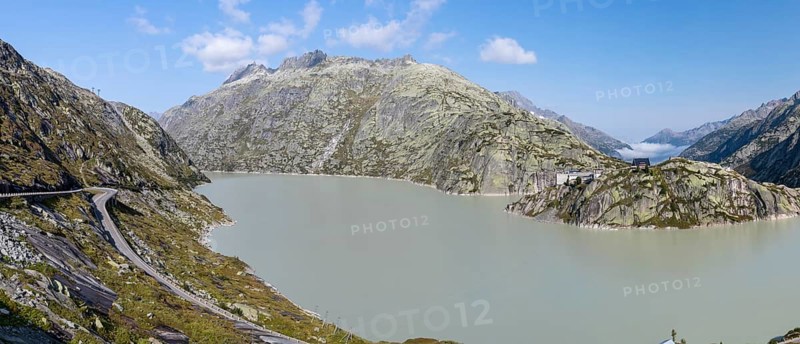 Grimselsee or Lake Grimsel with the historical Hotel Grimsel Hospiz near the Grimsel Pass in the Canton of Berne, Switzerland, Europe