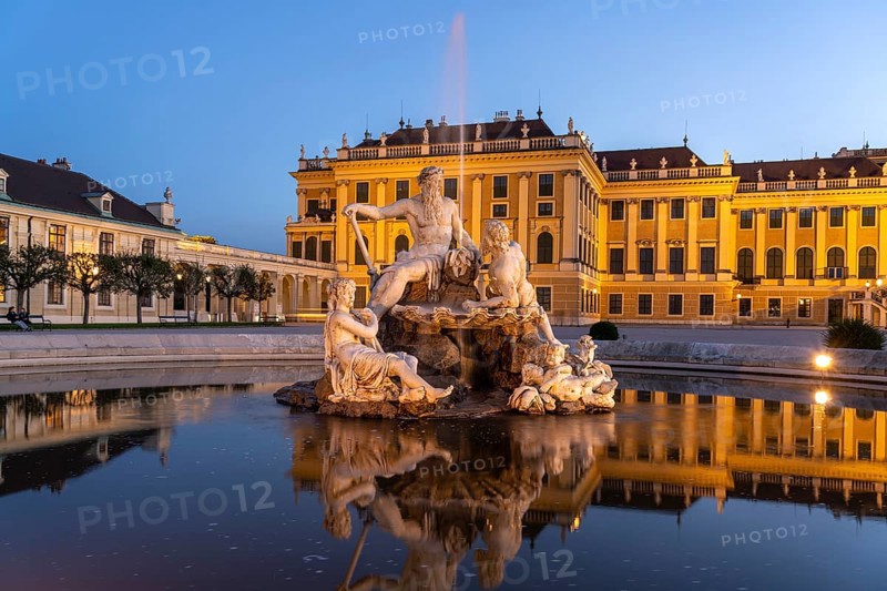 Fountain in the courtyard of honour at Schönbrunn Palace at dusk, UNESCO World Heritage Site in Vienna, Austria, Europe