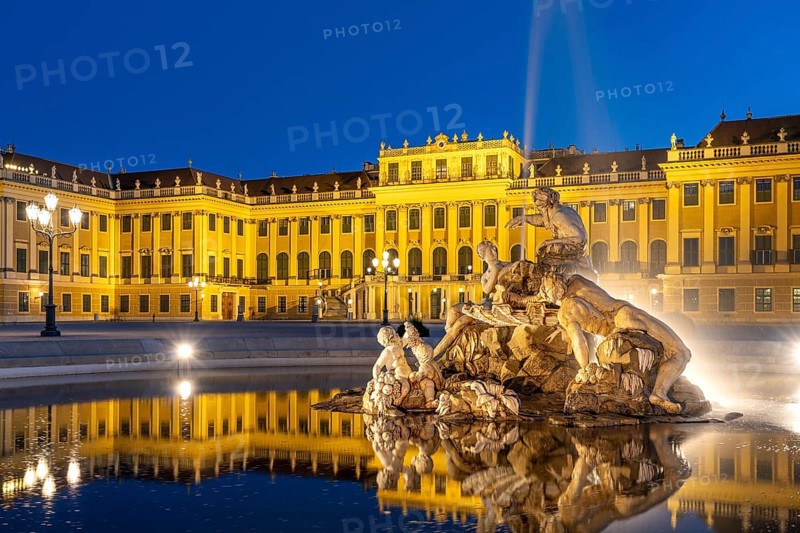 Fountain in the courtyard of honour at Schönbrunn Palace at dusk, UNESCO World Heritage Site in Vienna, Austria, Europe