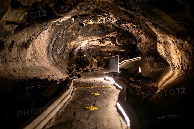 Tulelake, California - Mushpot Cave in Lava Beds National Monument. Lava tubes caves formed in the area thousands of years ago. Mushpot Cave is lighted with interpretive signs for caving novices