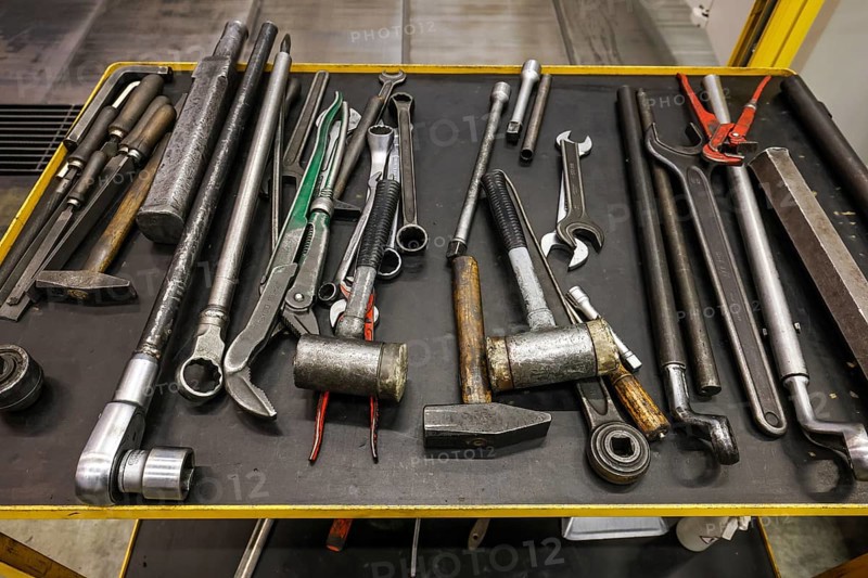 Übach-Palenberg, North Rhine-Westphalia, Germany - Tools on a tool trolley in an industrial hall of a machine factory