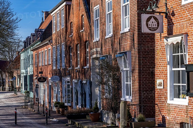 The fishing village of Greetsiel, municipality of Krummhörn, historic houses at the fishing harbour, in winter, Lower Saxony, Germany, Europe