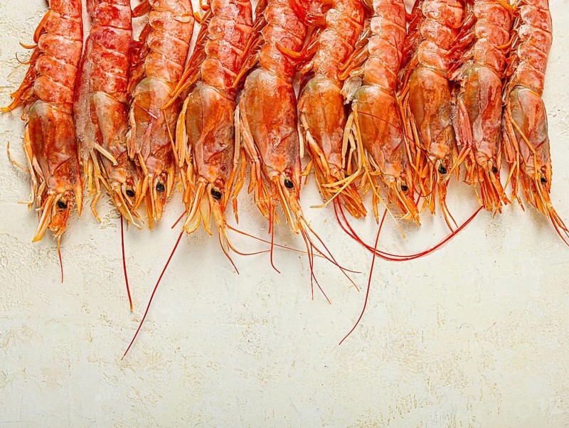 Langoustines, Australian, freshly frozen langoustines, on a light background, top view