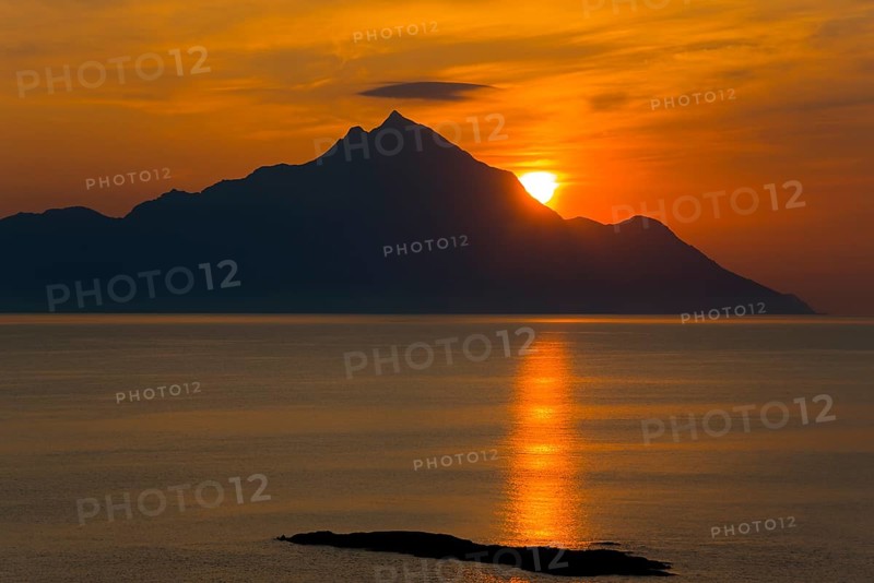 Dramatic sunrise over the mountains with golden reflections on the sea, majestic silhouette, view of Mount Athos, Orthodox monastic republic with autonomous status under Greek sovereignty, taken from Kriaritsi, Sithonia, Halkidiki, Central Macedonia, Greece, Europe