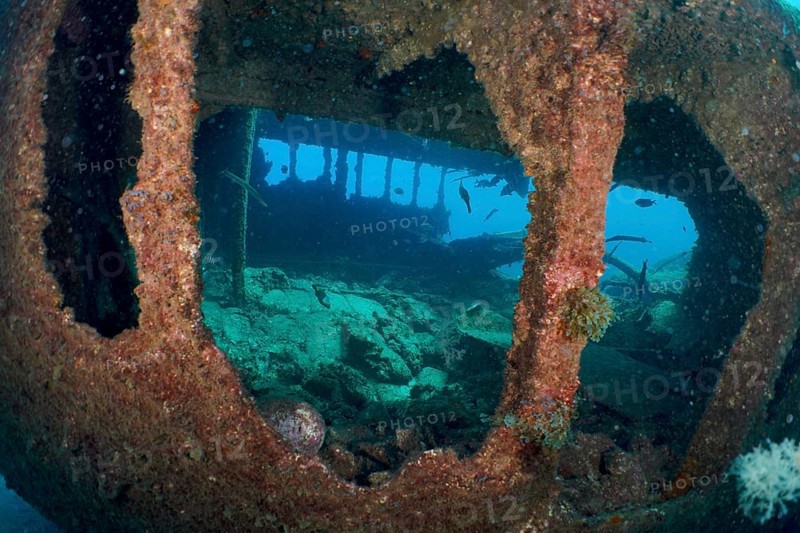 Underwater view of an old shipwreck in deep ocean blue, dive site Wreck of the Condesito, Las Galletas, Tenerife, Canary Islands, Spain, Europe