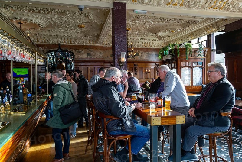 Customers in public bar inside Crown Hotel pub in city centre of Liverpool, England, UK