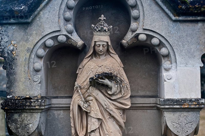 Sculpture depicting the Virgin Mary reading a book, tombstone in a cemetery, France, Europe