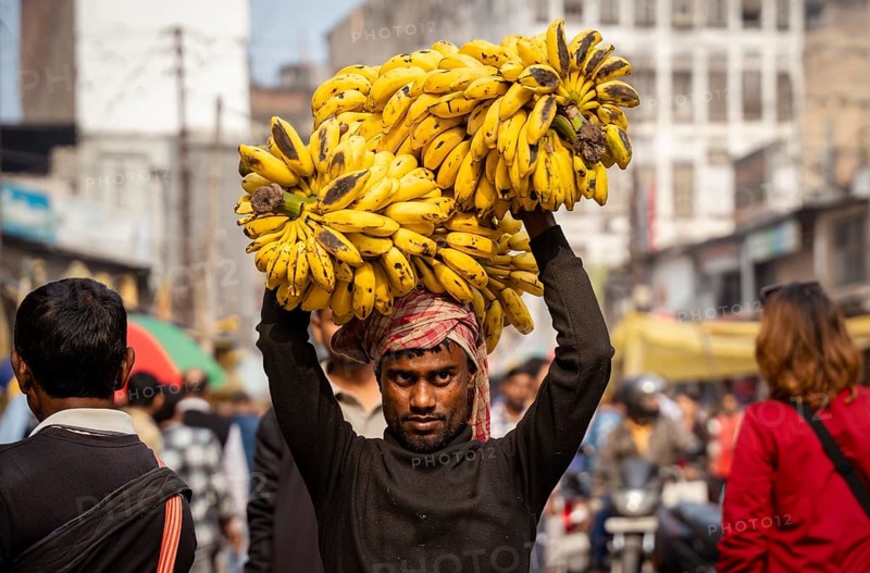 A labourer carries bananas on head in a market, on the day of the presentation of Union Budget, in Guwahati, India on 1 February 2025. Finance Minister Nirmala Sitharaman presented the Union Budget 2025-26 in the parliament today