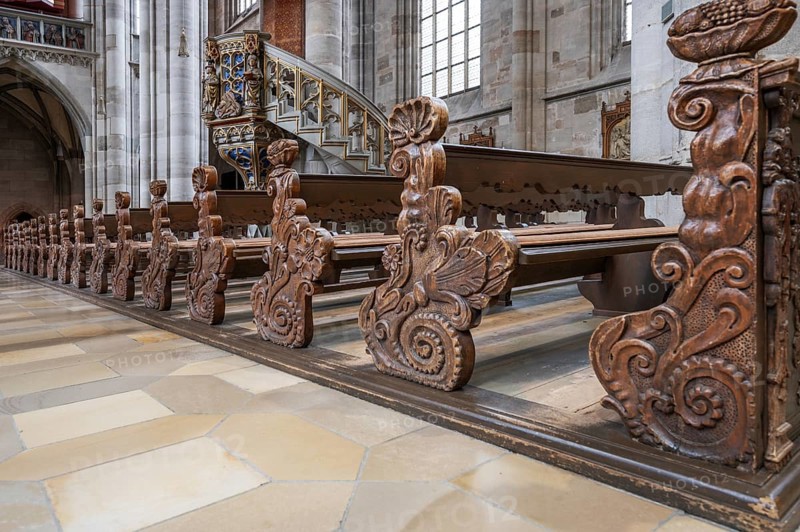 Cheeks of the pews in the late Gothic hall church of St George, Dinkelsbühl, Bavaria, Germany, Europe